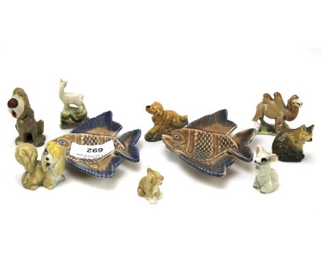 A collection of Wade Whimsies and two fish dishes. Models including: dogs, a camel, a fox and others similar