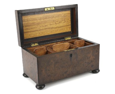 A late 19th century burr walnut adapted tea caddy Fitted with three compartmentalised trays, raised upon four bun feet, L31cm