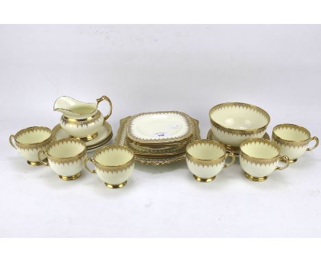 A Tuscan China gilt part tea service. Including tea cups, saucers, side plates, cake plate, a cream jug, etc Condition Report