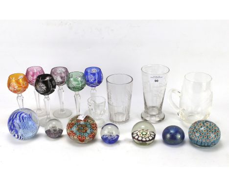 An assortment of glassware. Including millifiori paperweights, Caithness acrobat paperweight, 'opened Manchester ship canal J