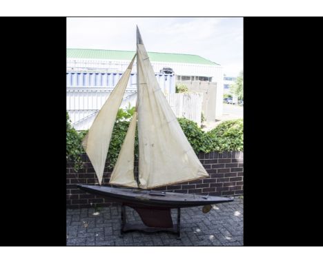 A Large Vintage J Class Pond Yacht, constructed in wood with painted hull and varnished deck with various fittings, original 