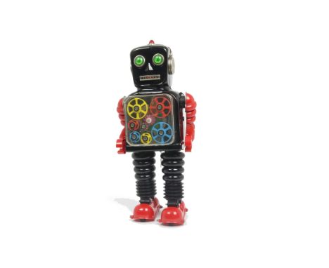 A Taiyo (Japan) Battery-operated Wheel-A-Gear Robot, large tinplate and plastic robot, black body, red plastic arms and feet,