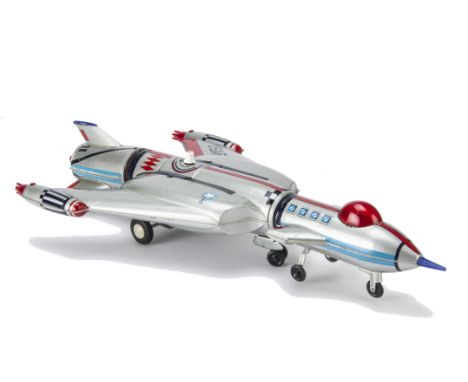 A Nomura/Nikko (Japan) Battery-operated Giant Three Stage Rocket, silver tinplate three section rocket, red plastic dome to f
