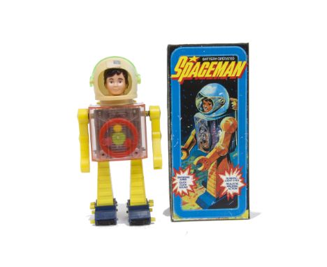 A TAT Hong Kong Battery-operated Spaceman, pink plastic body, yellow arms and legs, dark blue feet, astronaut helmet with Ame