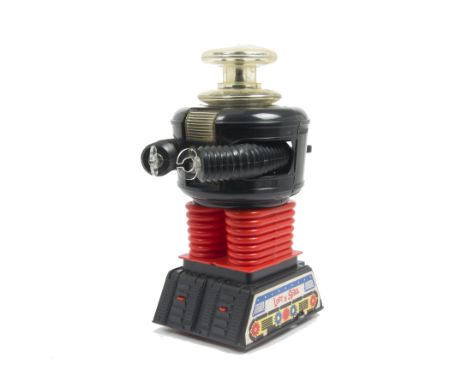 A Remco (USA) Battery-operated Lost In Space YM3 Robot, black plastic body, red legs, clear domed head, paper decals to base 