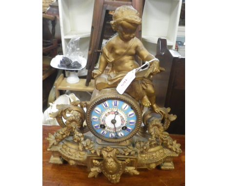 A FIGURAL SPELTER MANTEL CLOCK with painted dial with French movements striking on a bell