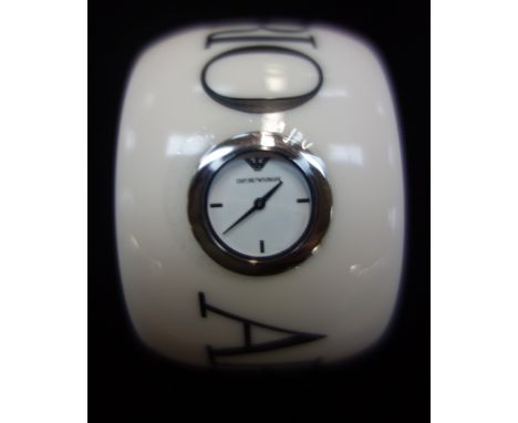 EMPORIO ARMANI, LADY'S EMBOSSED DESIGNER BANGLE, with inset white watch dial, black steel hands, silver baton numerals, quart