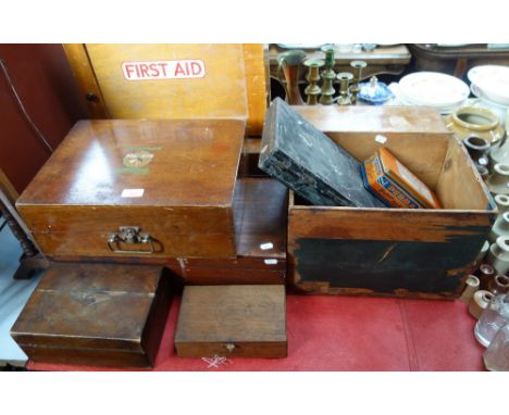 A VINTAGE WALL MOUNTED FIRST AID CUPBOARD, other wooden boxes and items