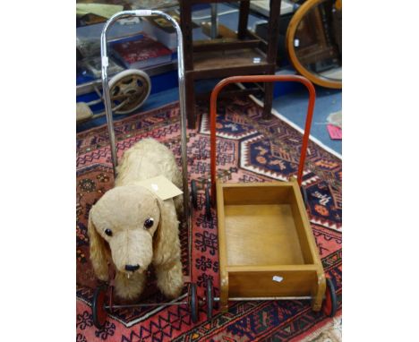 A VINTAGE PLUSH PUSH-ALONG DOG, by 'Chiltern Toys' circa 1930s and a Vintage 'Mobo' baby walker (2)