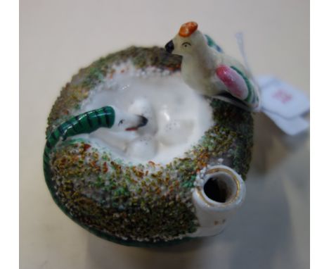 A 19TH CENTURY CERAMIC PEN STAND/INKWELL in the form of a nest, with a bird and a snake