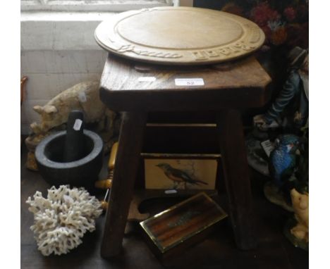 A 19TH CENTURY ELM STOOL, a vintage carved bread board and other items