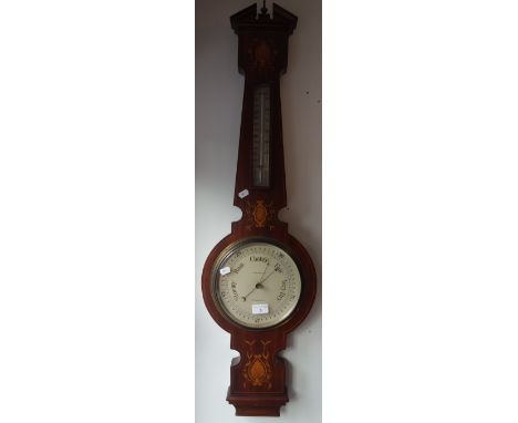 AN EDWARDIAN MAHOGANY CASED ANEROID BAROMETER AND THERMOMETER by Hurcomb &amp; Co, London
