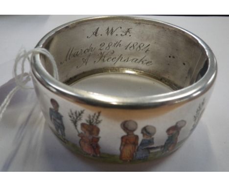 A VICTORIAN SILVER BANGLE, decorated with detailed enamel work of children planting trees, inscribed to the interior, 'A.W.J 