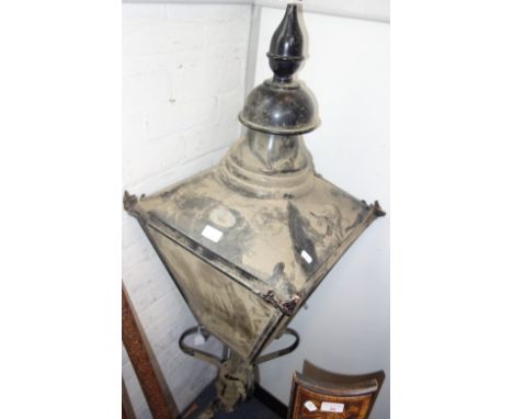 A VICTORIAN STYLE BLACK PAINTED COPPER STREET LAMP by D W Windsor mounted on a wall bracket