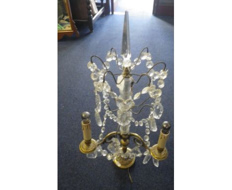 A THREE LIGHT METAL AND GLASS LAMP hung with prismatic drops