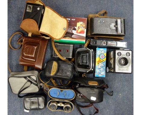 A VINTAGE IKONTA FOLDING CAMERA and a collection of cameras