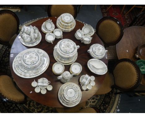 AN EXTENSIVE ROYAL WORCESTER DINNER SERVICE in the Mayfield pattern, set for twelve, to include tureens, vegetable dishes, et
