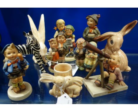 A COLLECTION OF HUMMELL FIGURES, three Sylvac bunnies and a ceramic zebra
