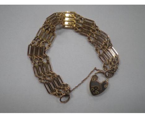 A 9CT YELLOW GOLD GATE LINK BRACELET, with padlock clasp and safety chain, approx. 16gm