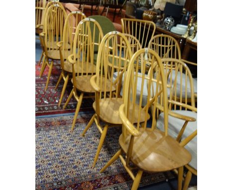 ERCOL; A SET OF SIX PALE BEECH AND ELM STICK BACK ARMCHAIRS