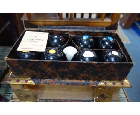 A VICTORIAN FAMILY BIBLE with gilt clasps, pub by Howard &amp; Co, London and a box set of 'Banda' carpet bowls