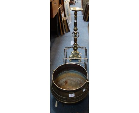 A BRASS CAULDRON SHAPED JARDINIERE, a magazine rack and a brass altar candlestick