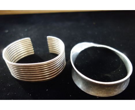 A GEORG JENSEN SILVER BANGLE, of twisted design and other bangle (2)