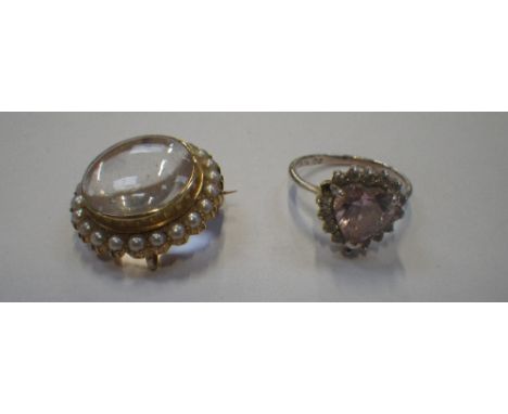 A 15CT GOLD BROOCH, with a central glass screen surrounded by seed pearls and pink heart gemstone ring with a silver shank, r