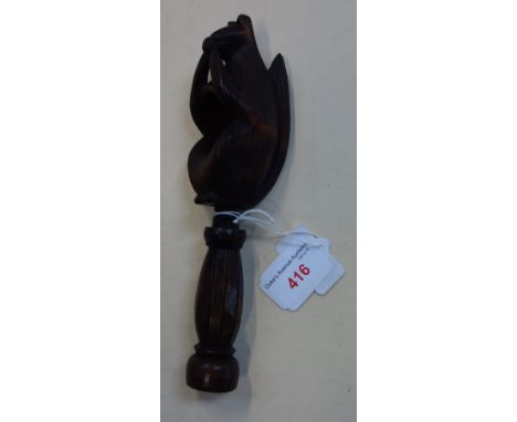 A BLACK FOREST NUT CRACKER in the form of a squirrel