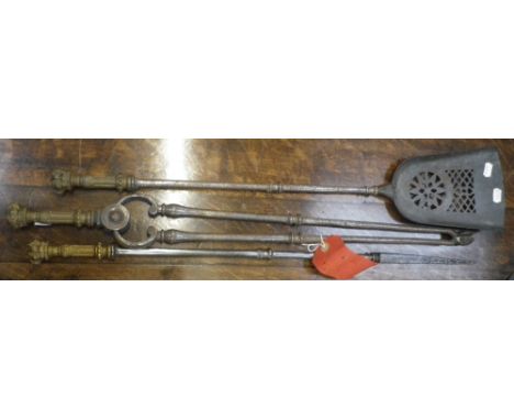 A SET OF 19TH CENTURY STEEL AND BRASS FIRE TOOLS