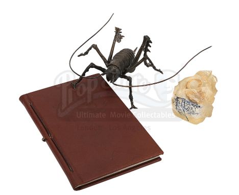 A notebook autographed by Peter Jackson and cast, promotional One Ring and weta bug from the making of Peter Jackson's adapta