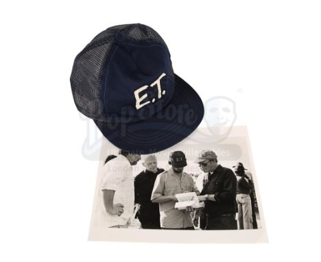 A crew cap and on-set photograph from Steven Spielberg's sci-fi adventure E.T. the Extra-Terrestrial. This item comes from th