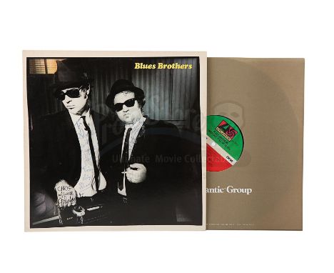 A "Briefcase Full of Blues" album dedicated to actor Christopher Lee and autographed by John Landis, John Belushi and Dan Ayk