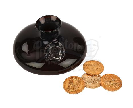 Brown Tom's (Cork Hubbert) glass bottle and cave coins from Ridley Scott's fantasy adventure Legend. The dwarf carried a bott