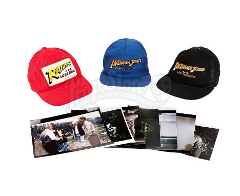 A set of crew caps and photographs from Steven Spielberg's Indiana Jones trilogy. These items come from the personal collecti