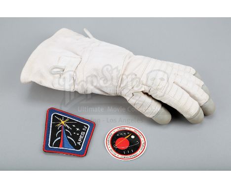 Mark Watney's (Matt Damon) "Iron Man" cut glove and Ares IV mission patch and decal from Ridley Scott's sci-fi film The Marti