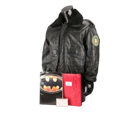 A production-used early draft script, crew jacket, soundtrack cassette and promotional binder from Tim Burton's superhero fil