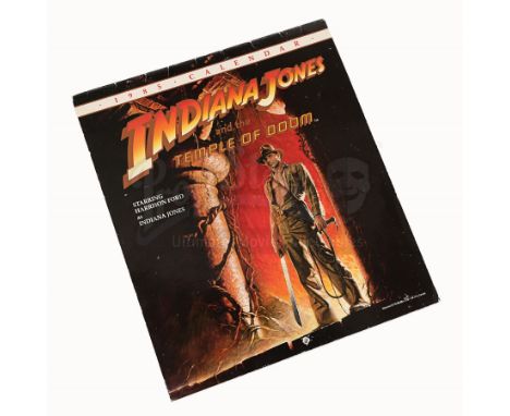 An autographed 1985 calendar from the promotion of Steven Spielberg's action-adventure sequel Indiana Jones and the Temple of