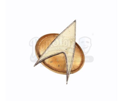 A Starfleet communicator badge from Star Trek: The Next Generation. Starfleet officers wore their badges on the left breasts 