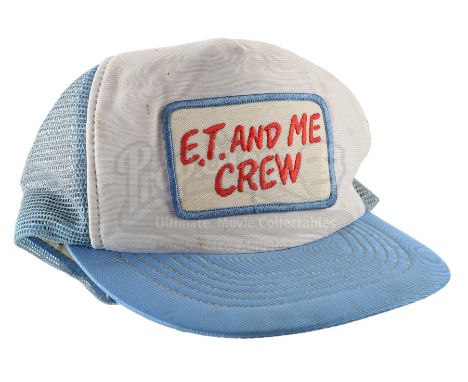 An "E.T. and Me" crew hat from the production of Steven Spielberg's sci-fi family film E.T. the Extra-Terrestrial. An alien s