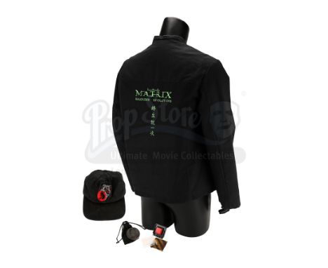 A pair of Nebuchadnezzar console buttons and a collection of crew items from the Wachowskis' The Matrix sequels. Various butt