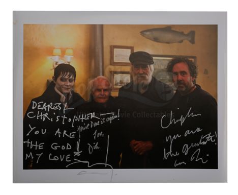 A photo autographed by Tim Burton, Johnny Depp and producer Richard D. Zanuck from Burton's horror comedy Dark Shadows. This 