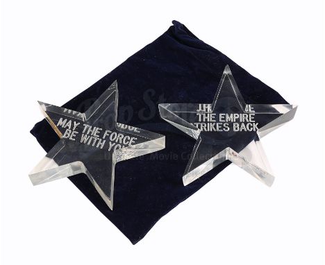 A set of two star-shaped paperweight crew gifts from Irvin Kershner's Star Wars: The Empire Strikes Back. Stars were gifted t