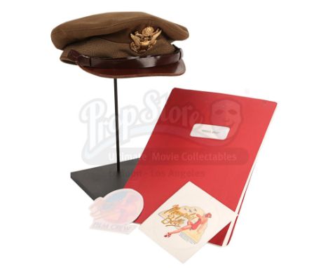 Captain Dennis Dearborn's (Matthew Modine) cap and a script from Michael Caton-Jones' World War II film Memphis Belle. Dearbo