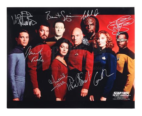 An autographed photograph of the cast of sci-fi TV show Star Trek: The Next Generation. This is a photograph of eight of the 
