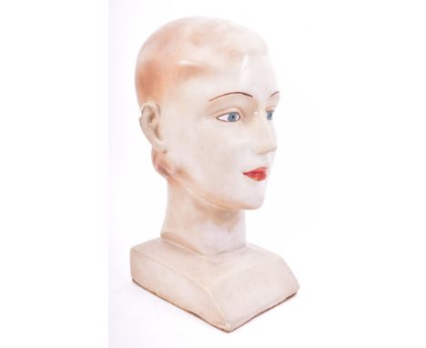 A vintage 1920s-1930s haberdashery / millinery point of display shop plaster mannequin bust head of a lady. The woman with pa