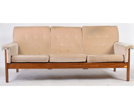 Guy Rogers - A retro 20th century British design teak framed three seater sofa settee. The sofa with salmon coloured button b