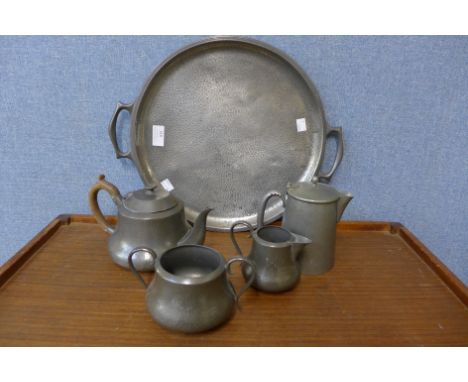 An Arts and Crafts pewter five piece tea and coffee service 