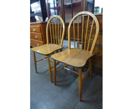 A pair of Ercol Blonde elm and beech Windsor chairs 