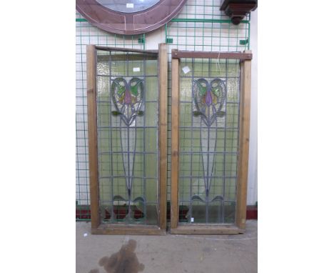 A pair of Art Nouveau stained glass windows, a/f 